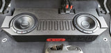 Close-up view of the BRP JT Gladiator underseat subwoofer enclosure with two Rockford Fosgate 10-inch subwoofers fully visible, without the seats installed