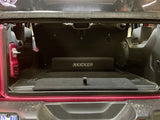 Down-Firing CompRT Kicker subwoofer enclosure installed in the trunk of a Jeep, showcasing a sleek fit and space-saving design with powerful bass performance
