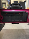 First step of installing the JK/JKU & JL/JLU subwoofer tailgate enclosure in a Jeep, showing the component that fits behind the enclosure, without the speaker included