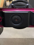 The JK/JKU & JL/JLU Jeep 12-inch American subwoofer tailgate enclosure installed in a pink Jeep, featuring JBL speakers for enhanced audio performance