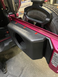 Side view of the JK/JKU & JL/JLU subwoofer tailgate enclosure installed in a pink Jeep, without the speaker, showing the enclosure’s fit and design