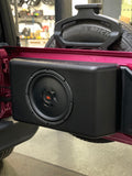 Side view of the JK/JKU & JL/JLU Jeep 12-inch American subwoofer tailgate enclosure installed in a pink Jeep, featuring JBL speakers for superior audio performance