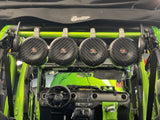 American Roll Bar installed in a green JKU Jeep Wrangler (2007-2018) with JBL speakers and mesh grill, designed for a secure fit with both soft and hard tops.