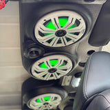 JK/JKU Kicker Kit American SoundBar installed in a car, featuring Kicker speakers with white charcoal grills and illuminated with green RGB lighting