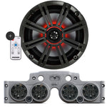 Close-up of a Kicker speaker, with a grey JK/JKU American SoundBar beneath it featuring 4 installed speakers with charcoal grills, an RGB controller on the side, part of the Kicker Kit, displayed on a white background