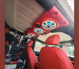 Red JK/JKU Kicker Kit American SoundBar installed in a car with matching red interior, featuring Kicker speakers with white charcoal grills and illuminated with aqua RGB lighting