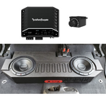 Installed BRP JT Gladiator underseat enclosure with Rockford subwoofer in a Jeep, paired with a pictstiched image of the Sub Amp Kit featuring the Rockford Fosgate R2-500X1 Mono Amplifier