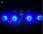 Black soundbar with white charcoal grilles covering the speakers and blue lighting controlled by the Kicker RGB LED Controller, part of a custom Jeep audio system.