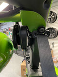 Close-up of the roll bar mounted flush on the stock back roll bar and securely connected to the seat belt bracket in a JLU Jeep Wrangler.