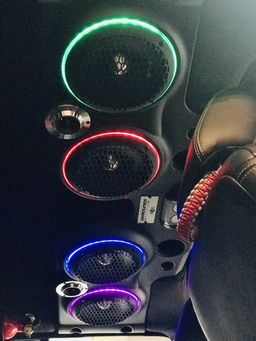Soundbar installed in a Jeep with RGB LED ring lights, displaying 4 different colors for each speaker in the soundbar.