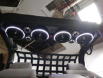 Soundbar installed with 4 speakers displaying white LED lighting, showcasing the RGB LED Ring Light Kit, in a Jeep audio system.